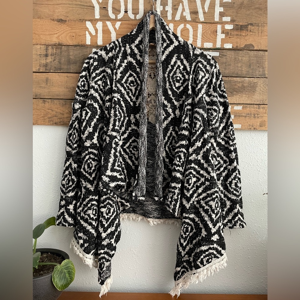 Takara Black and White knitted Poncho Sweater With Fringe and Lace